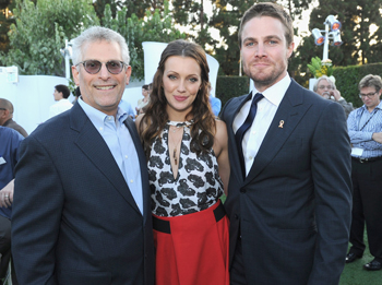 (L-R) President of The CW Television Network Mark Pedowitz and actors Katie Cassidy and Stephen Amell attend the CW, CBS And Showtime 2012 Summer TCA party held at The Beverly Hilton Hotel on July 29, 2012 in Beverly Hills, California.