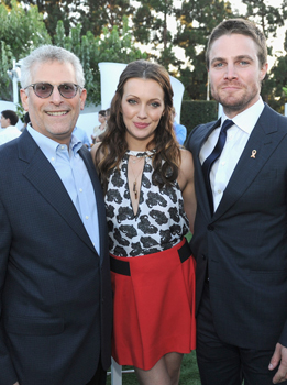 (L-R) President of The CW Television Network Mark Pedowitz and actors Katie Cassidy and Stephen Amell attend the CW, CBS And Showtime 2012 Summer TCA party held at The Beverly Hilton Hotel on July 29, 2012 in Beverly Hills, California.